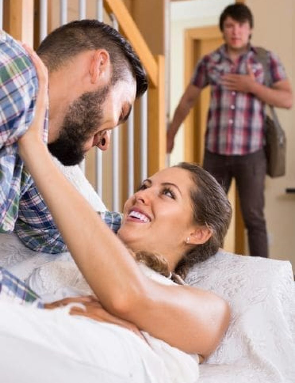 a man and woman lying on a bed cheating investigation