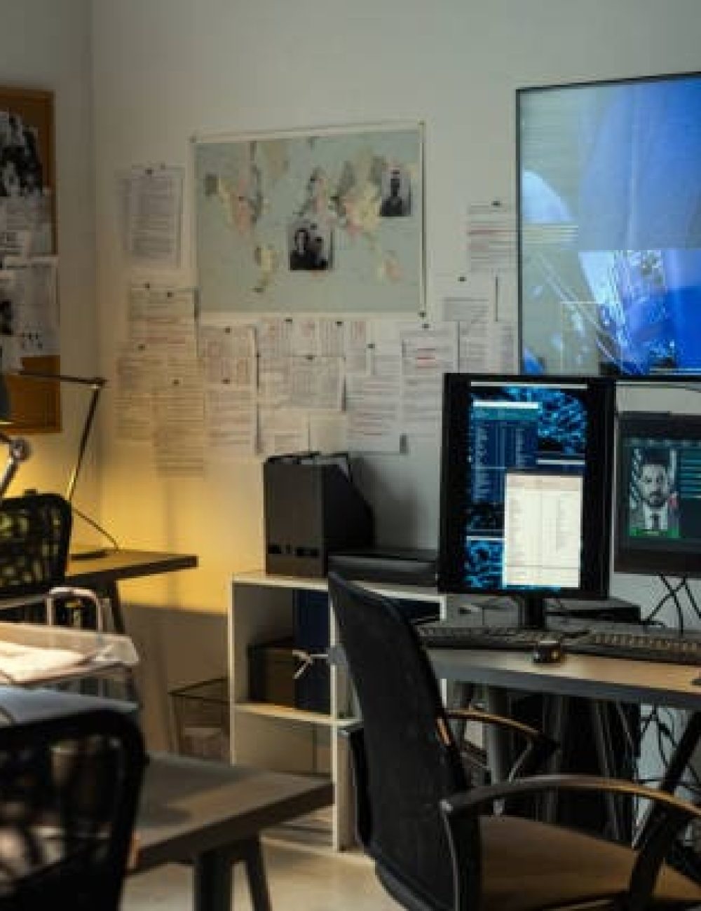 A office with papers and technology around in Private Detective Office