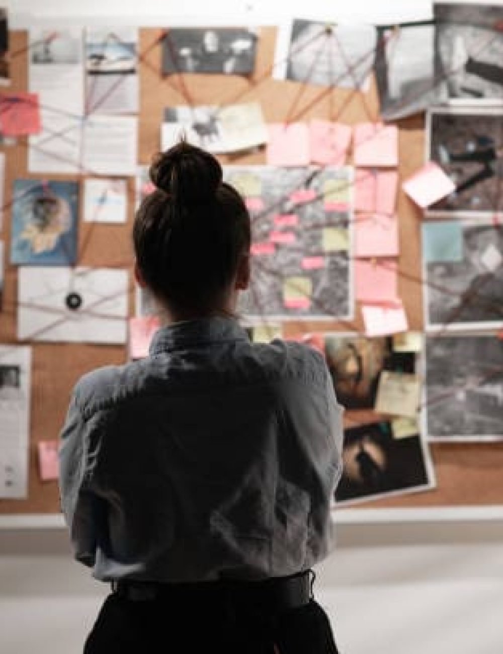 girl looking at a wall Personal Detective Agency