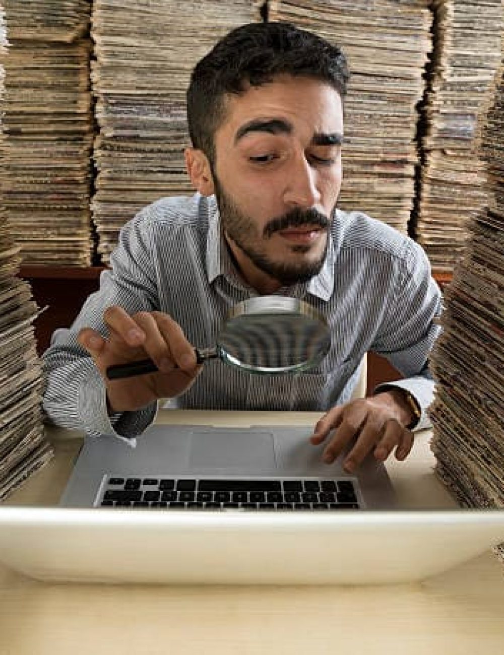 man looking at papers Private Detective to Find Someone